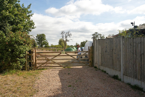 Gate to the Stable Yard
This five bar gate has been a nightmare for us.  We had it automated, but that never really worked.  The prevailing wind seems to "hit" the gate and damage the automation mechanics, and recent (October 2008) repairs didn't last more than a few days.  We've had people stand at the gate and watch us, like looking at a zoo exhibit.  We are installing larger gates this coming week.
Keywords: stable yard five bar gate Lucies Farm Maggot's Croft fence