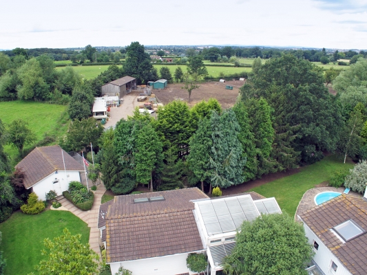 View Over Whitecroft
Showing the roof of the garage and indoor pool in the foreground, the dog resort on the left, and the stable yard in the background.
Palabras clave: Whitecroft stable yard garage indoor pool dog hotel dog resort