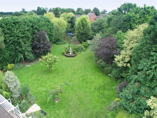 Front Garden at Whitecroft
An aerial view over the house itself, showing our swam fountain and the 1/4 acre pond in the distance.
Keywords: Whitecroft front lawn swan fountain pond