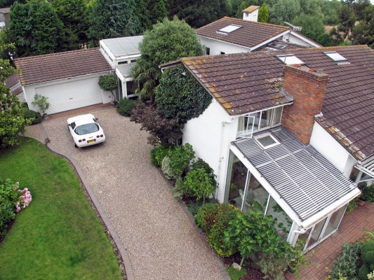 Aerial View from the Front Gate
A view from the front gate, showing the garage on the left, and the conservatory (with its electric shutters) in the right foreground.  The main house is to the right.
Ključne besede: Whitecroft conservatory Corvette garage house