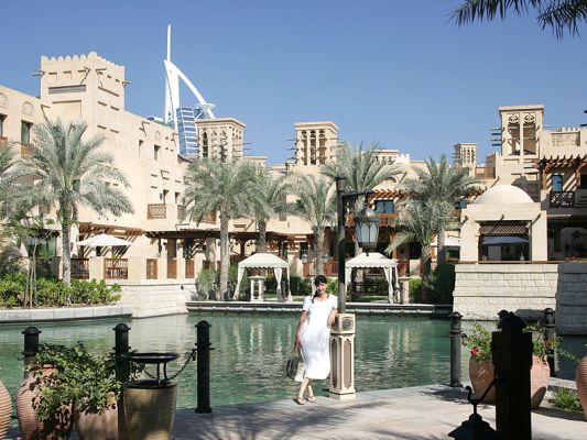 Dar Al Masyaf - Daytime
The view from our "boat stop" on the canal system at the Dar Al Masyaf villas, with Marjorie waiting for the next boat.  The top of the Burj al Arab Hotel can just been seen peeking over the top of the Madinat Jumeirah.
Ключови думи: Dar Al Masyaf boat stop Madinat Jumeirah Burj al Arab Dubai