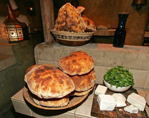 Dinner at the Bab al Shams
We went to a great outdoors dinner in a "fort" that had been created in the desert.  Here's some not-so-flat flatbrad and some great cheese.
Ключові слова: flat bread Bab al Shams desert cheese