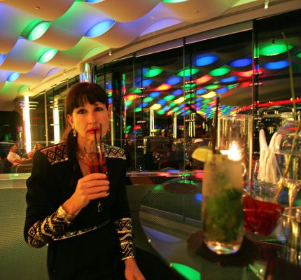 Marjorie Enjoying a Mojito
We had our first [url=http://www.bacardimojito.com/]mojito[/ul] cocktails in Havana, where they were invented.  But the mojitos at the top of the Burj al Arab Hotel in Dubai were a close second.
Ключові слова: Marjorie mojito Burj al Arab cocktail lounge view