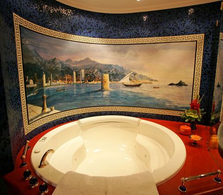 Our Bathtub -- Burj al Arab Hotel
Our suite ([i]all[/i] rooms at the Burj al Arab Hotel are suites) covered two floors, with a long curving staircase connecting the floors.  We had a large shower and a big round bath tub, complete with a painting of Dubai.
Ključne besede: bathtub Burj al Arab hotel suite