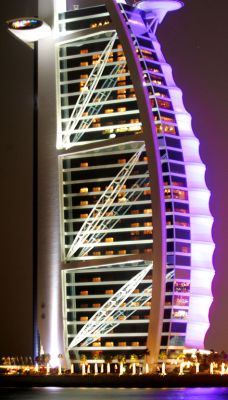 Burj al Arab Hotel
The right side of the hotel --- bathed in purple light --- is made from Kevlar, and is designed to look like a sail.  The whole hotel is on a man-made island just offshore in the Arabian Sea.  The colours on the side of the hotel change every few minutes.
Anahtar kelimeler: Dubai Burj al Arab hotel Kevlar Dubai