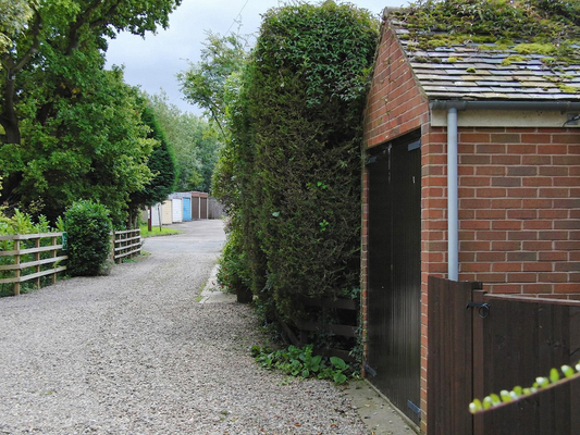 A view of the outer driveway with the Godwins' garage
Ключові слова: Drive Driveway Whitecroft