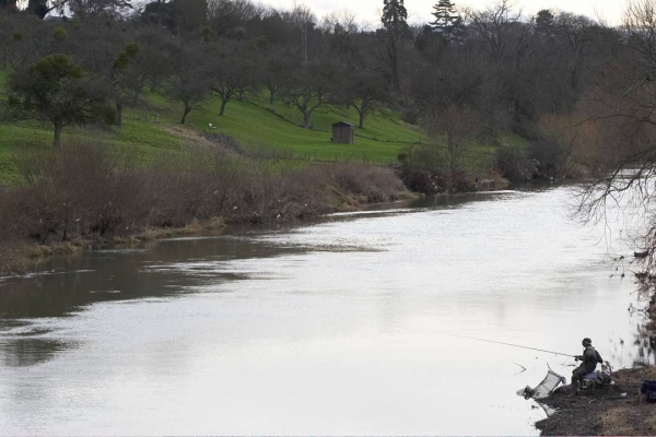 Fishing on the River Avon Near Fladbury
Some of the litter from the recent floods can be seen near the solitary fisherman.
