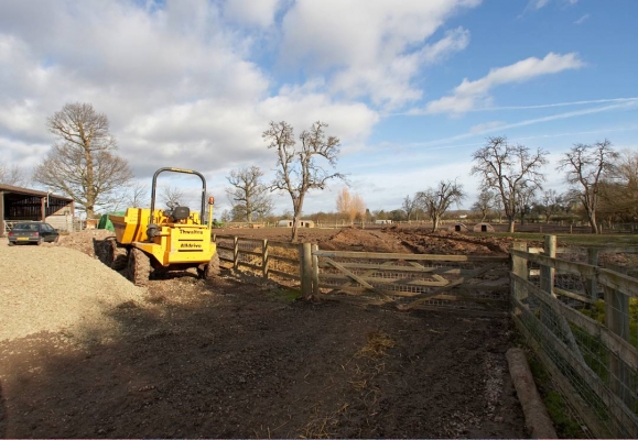 The Path to the Pig Arcs
The hard core has been put beneath the pig arcs (in the distance) but needs to be compacted on Monday.  The last part to be finished is the hard core road from the stable yard (where this was photographed) to the pig arcs.
Keywords: Clay Construction Lucies Farm Maggot's Croft Mud Pigs