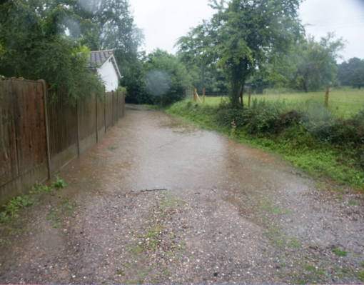 Our Track, Behind the Dog Resort
This is our track behind the dog resort (on the left) during the flood.  The drains on the side of the track had become clogged.  A bit of shovel work, and the drains were open.
Λέξεις-κλειδιά: Whitecroft rain flood track