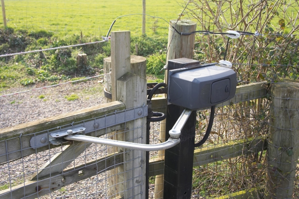 Motor and Arm -- Stable Gate
This is the motor and arm that open and close (when they work, which they now don't) the stable gate.  The wires and conductors on top of the gate and fence are unrelated to the automation system --- they are part of the Gallagher electric fence system --- to keep foxes out.
Keywords: stable gate motor automated gate Gallagher