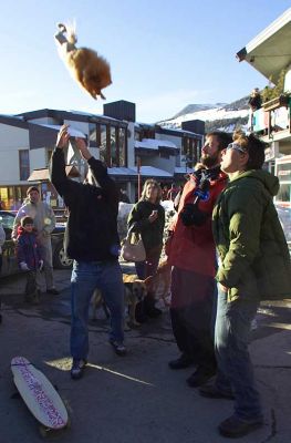Throwing the Dog Into The Air
The skateboard dude stunned us all -- including Tom Green, holding the microphone -- by tossing his little dog into the air.  Fortunately, he caught the dog.
Keywords: dog air Tom Green Italy Sestiere Italy