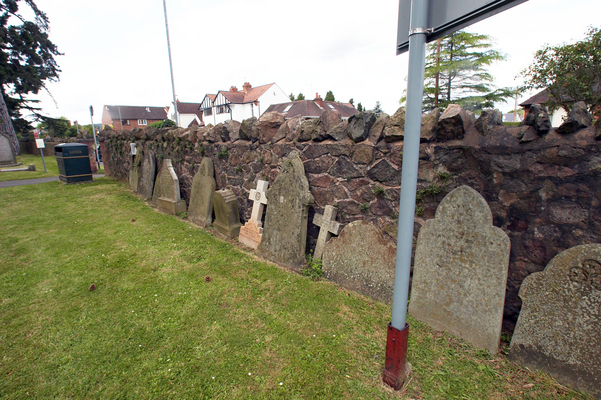 Fallen headstones, St Matthias, Malvern Link, Worcestershire
"Tip" is a big problem for gravestones in the UK.  There are even special "tip" meters used in graveyards to try to ascertain which stones are in danger of falling.  At St. Matthias the fallen stones are put up against one of the walls of the graveyard.
Keywords: Cemeteries Cemetery Church Churches Graveyard Graveyards Headstone headstones Malvern Malvern Link St Matthias Worship