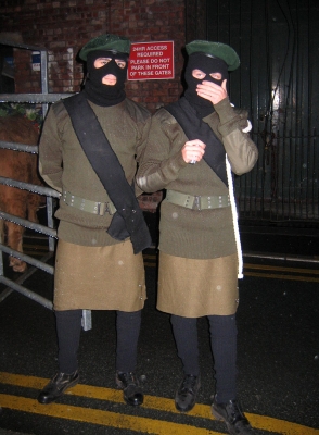 Artur and Grzegorz In Their Costumes
At dress rehearsal we had a visit from the Manchester Police.  They were concerned about guys in IRA uniforms hanging around the back of the Manchester Opera House --- with a bull.
Ključne besede: Artur Ivanyan Grzegorz Bednarski IRA Manchester Opera House