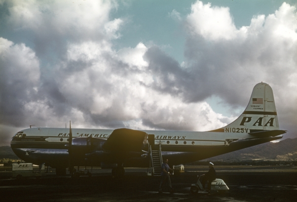 PanAm Boeing Stratocruiser 377 in Honolulu, Circa 1949
I did a Google search on this aircraft, N1025V.  It was the first of 21 Stratocruisers delivered to PanAm (delivered on January 31, 1949).  At the time it was called "Clipper America," although that doesn't seem to be the name in this photograph.  (PanAm apparently had many aircraft called "Clipper America" over the years.) N1025V is now sold as a model. The real N1025V was sold to the Israeli Air Force in 1963 as a cargo plane, and last flew in March 1974.
Keywords: Aircraft Boeing Boeing 377 Honolulu Airport N1025V Pan American PanAm Plane Planes Propeller Stratocruiser Transport Aeroplane Aeroplanes Air Travel Transportation Airplane Airplanes Airtravel Aviation