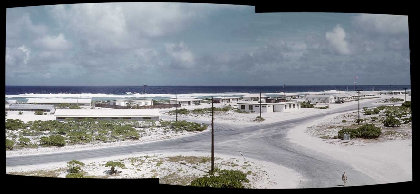 PAAVille Skyline - Wake Island
I would guess this in the main intersection of PAAVille on Wake Island, photographed by my father, Woody Walsh, circa 1953.  He took a series of slides, and these two images were stitched together with modern software.  I like the one lone soldier walking in the lower right hand corner --- he's the only sign of "traffic."
Anahtar kelimeler: Atoll Atolls Island Islands Ocean Oceans PAA PAAVille Pacific Ocean Pan American PanAm Wake Island