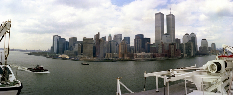 Arriving in New York City on the QE2 - April 1991
This panoramic photograph, taken with a Widelux camera from the top deck of the QE2, is now quite poignant because of the prominence of the two towers of the World Trade Center.   We couldn't have imagined when we took this photograph on a warm spring day in April 1991 that just over a decade later both towers would be gone.  In November 2008 the QE2 sails to Dubai where she will be permanently moored.
Palabras clave: Arrival Cruise Cruise Liner Cruise Liners Cruise Ship Cruise Ships Cruises Luxury Liner Luxury Liners New York City New York Harbor New York Harbour Panorama Panoramic QE2 Queen Elizabeth II Widelux