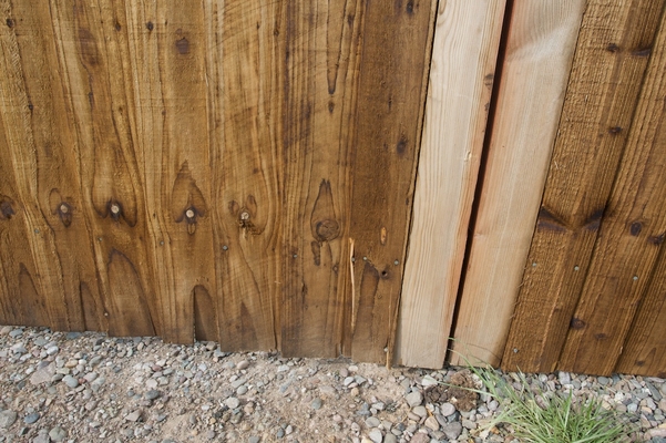 Lower Portion of Gates
Photographed from the outside, showing how the boards are cracking.  The northern gate (left in this photograph) has particularly settled, so it is dragging on the hardcore and the boards are cracking.
Keywords: northern gate