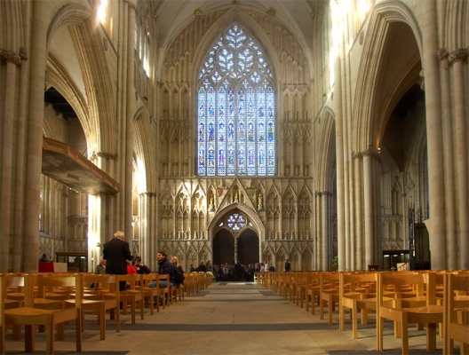 York Minster Cathedral
Looking towards one entrance on a sunny day in late November, 2006.  The website for the Cathedral is at [url]http://www.yorkminster.org[/url].
Keywords: York Minster Cathedral stained glass church pews winter
