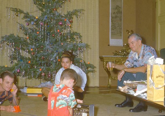Christmas at 140 Dowsett Avenue, 1950
My father (cigarette in hand) calling me on my toy telephone.  Mother looks on, as does a gentleman I don't recognise --- cocktail in hand.  
Keywords: Christmas Dowsett Avenue John Shirley Craig