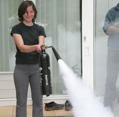 Emilia and the Fire Extinguisher
Emilia testing an out-of-date fire extinguisher.
Keywords: Emilia fire extinguisher Whitecroft Chubb
