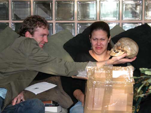 Chase, Brett and the Christmas Skull
For Christmas 2003 I decided Chase would like a human skull. After all, for my birthday she gave me silver cufflinks made from her wisdom teeth. Did she like the skull? You be the judge.
Keywords: human skull