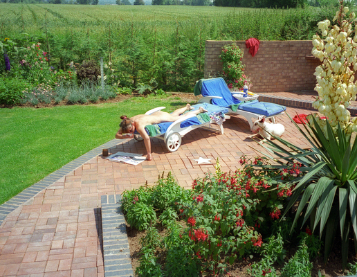 Sunbathing at Whitecroft
Marjorie and Pau enjoying the sunshine.  Surprising how short the leylandii were in 1994 -- by 2010 they were 20 feet high, and needed constant trimming.
Keywords: Marjorie Pau sunbathing Whitecroft leylandii