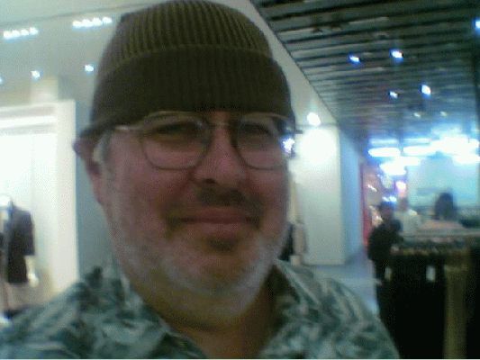 Craig's Excellent Hat
We went shopping at the new Selfridge's in Birmingham.  Fortunately, the only part of his hat I took home was this picture, snapped with my cell phone camera.
