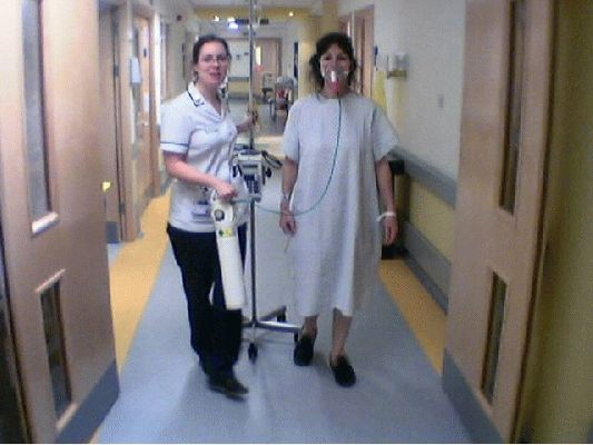 Marjorie with Pneumonia
In early 2003 Marjorie had a bad bout of pneumonia.  Here she's prowling the corridors of the Worcester Royal Infirmary with the physical therapist.
Klíčová slova: pneumonia Worcester Royal Infirmary