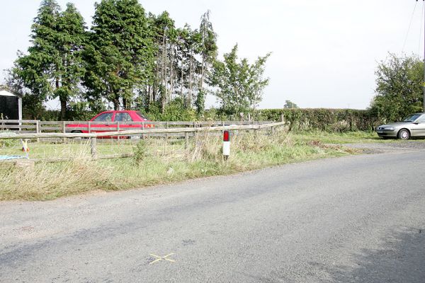 Woodman's Cottage
Looking from across the Bransford Road (also called Station Road) towards the East.  The survey mark is shown with a yellow cross in the road surface.
Keywords: Woodman's Cottage Lord's Wood Thomas Hawkins
