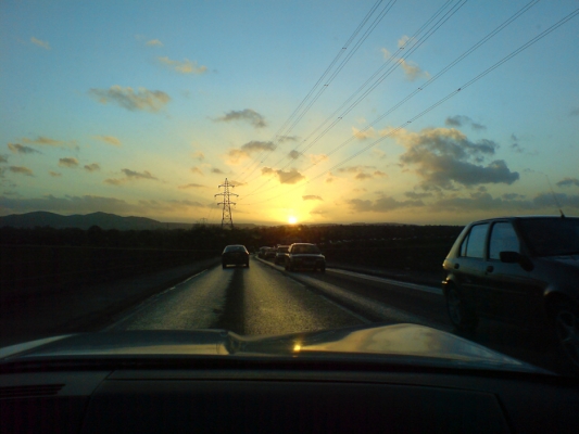 Driving Across The New Bridge
Heading home to Whitecroft across the New Bridge (over the Severn), with the sun setting over the Malvern Hills.  What bright spark thought this gorgeous view could be improved by the presence of large electricity distribution cables and towers?
Keywords: Malvern Hills sunset electric cables towers heading home