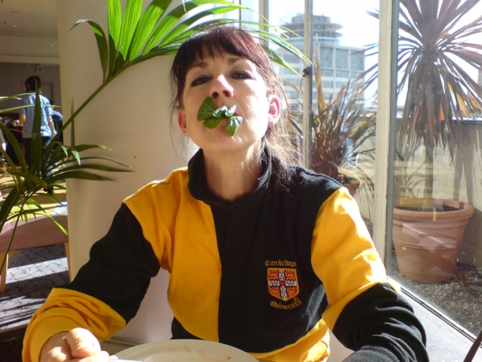 Marjorie and the Lamb's Lettuce
Having lunch at the "rooftop" restaurant at the House of Fraser store in Birmingham.  Marjorie has a mouth full of lamb's lettuce.  That's the [url=http://www.en.wikipedia.org/wiki/Rotunda_(Birmingham)]Rotunda[/url] in the background --- they're doing some work on the round building.  And do you like the tropical palm trees?
Ключевые слова: Marjorie House of Fraser Rotunda Birmingham palm trees