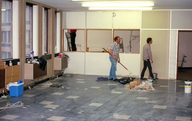 New Transax Offices in Tricorn House, Edgbaston, Birmingham
This was photographed in the autumn of 1987.  We'd just rented offices on the 9th floor of Tricorn House in Edgbaston, and set about decorating them ourselves.  Chris Wilesmith has the paint roller, while Peter French is looking for something.  The room in the foreground became the authorisation centre, and the staff break room was behind the partition.
Λέξεις-κλειδιά: Tricorn House Transax Chris Wilesmith Peter French authorisation centre cheque guarantee
