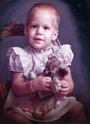 Chase and my Teddy Bear
I think this is a great picture of Chase, and it's the last known photo of my teddy.  The teddy was purchased at the gift shop in Kapiolani Maternity Hospital the day I was born.  It had a red felt tounge and wooden eyes.  It went with me to university (my mother hid it in my suitcase).  When Marjorie and I moved to the U.K. in 1986, Chase asked if she could keep it.  And then my ex-wife, the Rev. Marcia, made Chase give it away.  Lost teddies.  Stinky ex-wives.
Avainsanat: teddy Chase Marcia Eveland