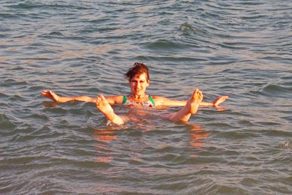 Marjorie Floats in the Dead Sea -- Jordan
We took an "afternoon dip" in the Dead Sea, 1989.  Because of the high salinity it was impossible to do much more than float.  And the salt irritated every small cut you didn't even know you had.  When we got out, the soap wouldn't lather to wash off all of the salt.
Keywords: Marjorie Dead Sea Jordan salt salinity