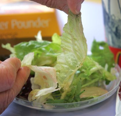 The Fresh Garden Salad, McDonald's Style
Marjorie and I had to pick up some paint -- and I wanted lunch.  Marjorie normally doesn't let me go to McDonalds, but I convinced her to give it a try because of their new, healthy food.  Their [url=http://www.mcdonalds.co.uk/?f=y]website[/url] talks about garden salads made "using a host of wholesome ingredients including at least 6 varieties of salad leaves."  This is Marjorie's [i]second[/i] garden salad:  her first was inedible.  We were told this salad was "freshly made." Hmmm.
Keywords: McDonalds garden salad lettuce