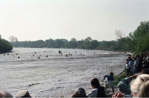 Surfin' the Severn Bore
This is the large wave (bore) coming up stream, photographed from the Severn Bore Pub.  They actually surf the wave, and ride kayaks, etc.  Marjorie and I were surprised (although I don't know why) at how muddy the water was.  Guess this isn't Makaha.
Ключові слова: Severn Bore Makaha surfing