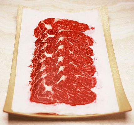Scottish | Kobe Shabu Shabu Beef
This is aged Scottish | Kobe topside, frozen, and then cut paper thin.  We pack it on special grease proof, food-grade paper.  It's delicious in [url=http://www.luciesfarm.com/artman/publish/article_35.php] shabu shabu[/url] --- and we have a good customer who eats in raw, as carpaccio.
Keywords: Kobe beef, Scottish | Kobe, topside, shabu shabu, carpaccio, raw beef, prime steak, Kobe