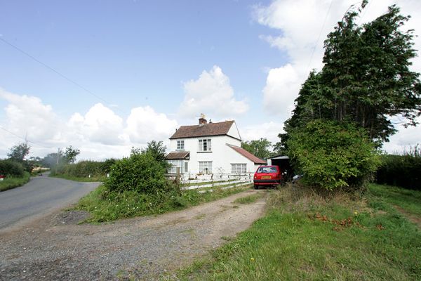 Woodman's Cottage
Our track to Lord's Wood on the right of the photograph.  This is taken from the triangular piece of land in the front, which is (according to our deeds and recent survey) our property.
Keywords: Lord's Wood Woodman's Cottage