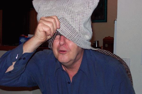 Bit hard to see with the hood on perhaps I will peep just a little
John working out how to use the lovely birthday present sent by Marjorie, the daschund dogs were so realistic.
